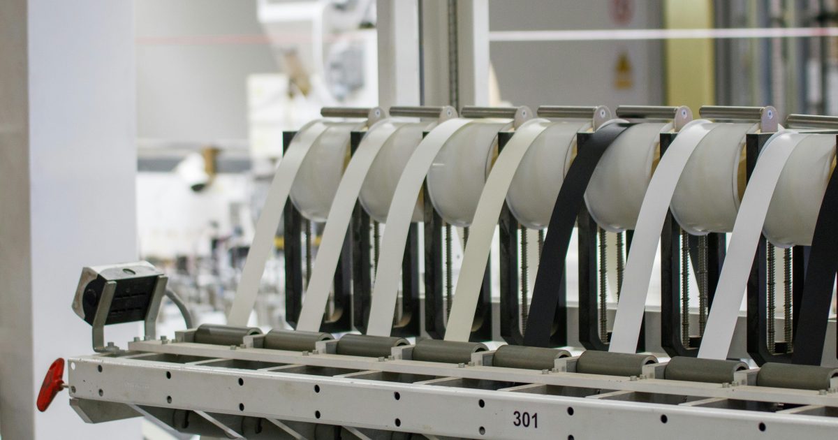 Modern industrial machine in operation in a manufacturing facility showcasing advanced technology.