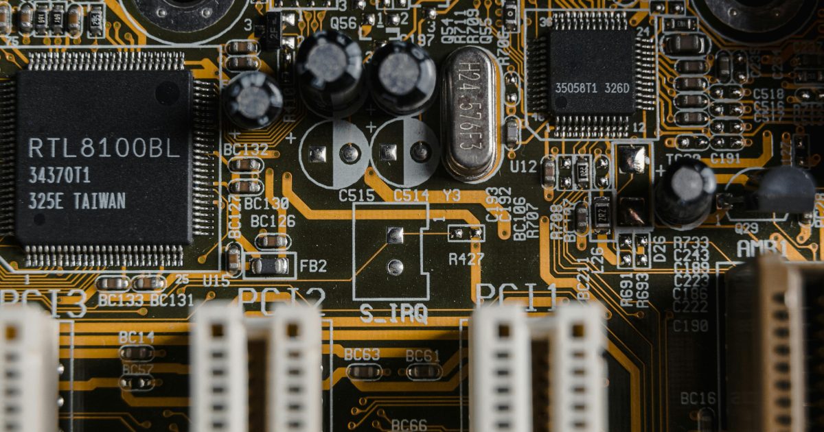 Detailed view of a motherboard with visible microchips and circuits.