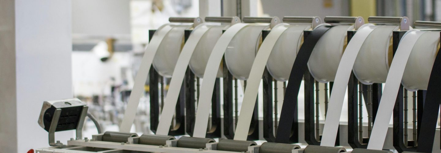 Modern industrial machine in operation in a manufacturing facility showcasing advanced technology.