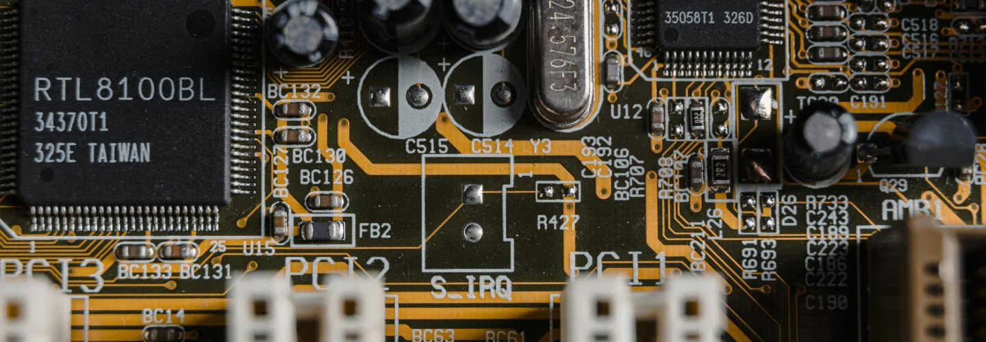 Detailed view of a motherboard with visible microchips and circuits.
